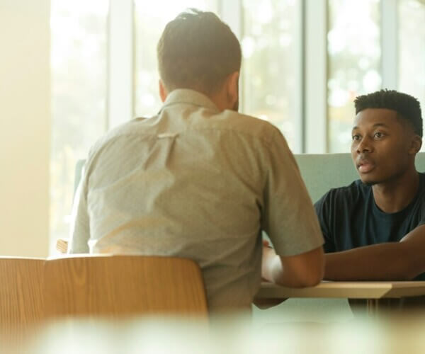 two men talking