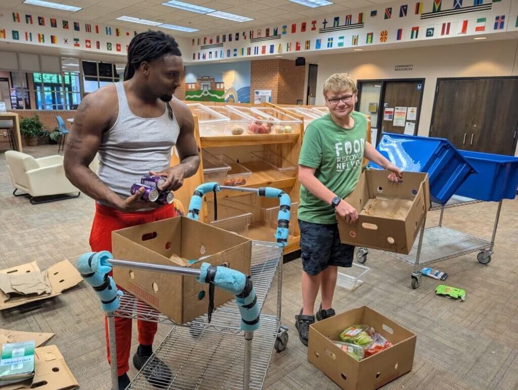 Sedrick O'Neal and William Grunewald serve at Central Lakes College in Brainerd, Minnesota.